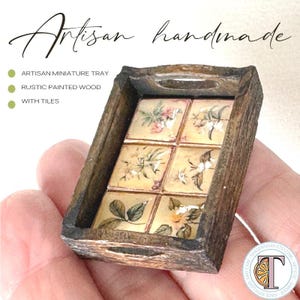 May include: A miniature wooden tray with a rustic painted finish. The tray is decorated with six small, hand-painted tiles featuring floral designs.