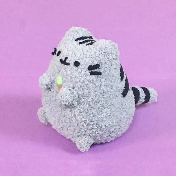 pusheen holding ice cream