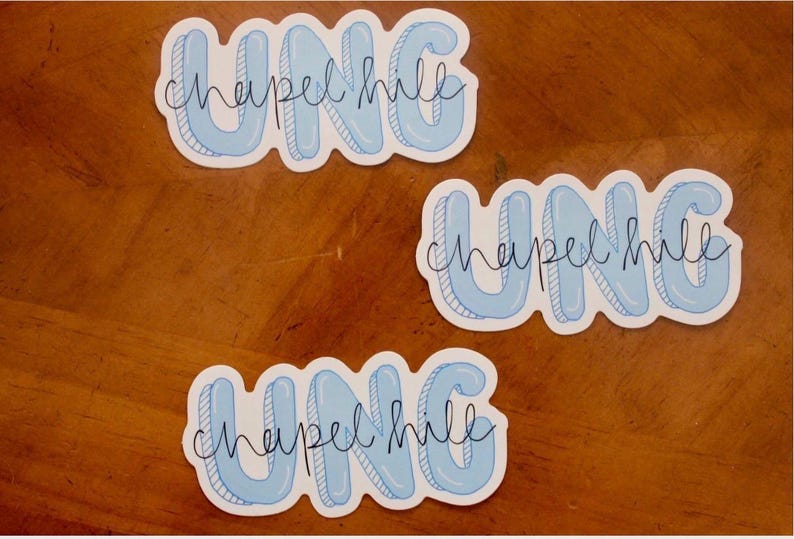 May include: Three stickers with the text "UNC Chapel Hill". The stickers have a light blue bubble letter design with a white outline and the words "Chapel Hill" in a cursive font.