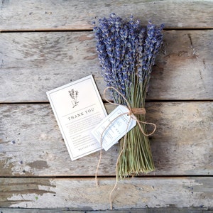 May include: A bouquet of dried lavender tied with twine and a small white tag that says "Thank You" and "Nustad Family".