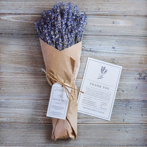 May include: A bouquet of purple lavender flowers wrapped in brown paper with a thank you note and a tag that reads "Lavender & Linen Co. Fresh Cut Flowers".