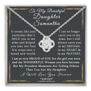 May include: A silver necklace with a knot pendant and a message card in a black box. The card reads "To My Beautiful Daughter Samantha" and includes a heartfelt message about the bond between a parent and child. The card also includes the text "I Will Love You Forever".