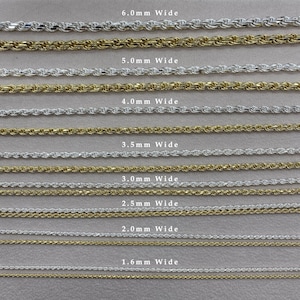 May include: A close-up of eight rows of rope chains in silver and gold. The chains are arranged from largest to smallest, with the largest chain being 6.0mm wide and the smallest chain being 1.6mm wide. The chains are labeled with their width in millimeters.