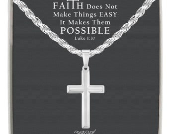 Può includere: Collana con pendente a croce in argento. La croce è su una catena a corda d'argento, presentata su uno sfondo grigio scuro. Il testo "FAITH Does Not Make Things EASY It Makes Them POSSIBLE Luke 1:37" è stampato sopra.