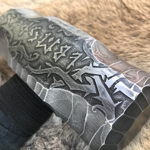 6 pound Sledge Hammer, Head is Rustic Hand Engraved with Cursed Runes and Briar Knots. Handle is Dark American Hickory with Black Suede Leather Wrap and rune burned into the bottom.
