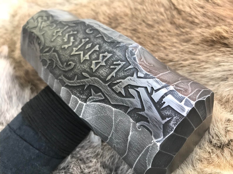 6 pound Sledge Hammer, Head is Rustic Hand Engraved with Cursed Runes and Briar Knots. Handle is Dark American Hickory with Black Suede Leather Wrap and rune burned into the bottom.