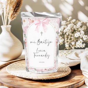 May include: A white ceramic mug with a black handle and the text "But First, Coffee" in a handwritten style. The mug is on a white surface. The mug is 4 inches tall.