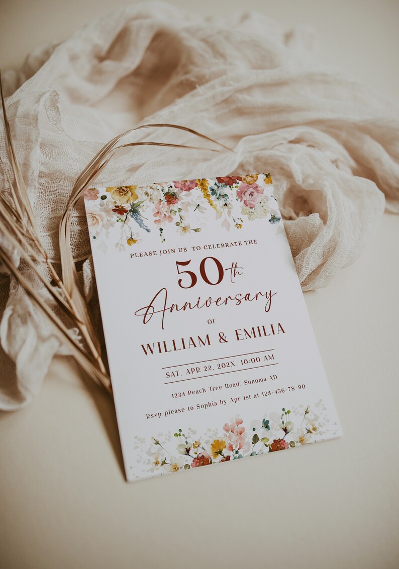 May include: A white invitation card with a floral border. The text reads "Please join us to celebrate the 50th Anniversary of William & Emilia. Sat. Apr 22. 202X, 10:00 AM 1234 Peach Tree Road. Sonoma AD Rsvp please to Sophia by Apr 1st at 123-456-78-90"