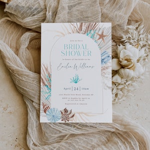 May include: A light blue and white bridal shower invitation featuring a watercolour design of seashells, palm leaves, and starfish. The invitation reads "Join us for a Bridal Shower in honour of the bride-to-be Emilia Williams" and includes the date, time, location, RSVP information, and registry details.