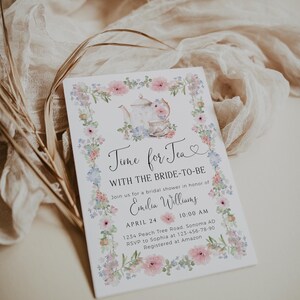 May include: A floral invitation for a bridal shower, featuring a teapot and teacup illustration. The text reads "Time for Tea" and includes the bride's name, date, time, and location. The design incorporates pink and blue flowers.