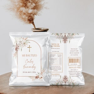 May include: A white and gold foil bag with a floral design. The bag has the text "Mi Bautizo Carlos Fernandez 24 de abril, 202x" on the front. The back of the bag has a nutritional label with the text "Datos de Nutricion" and a list of ingredients.