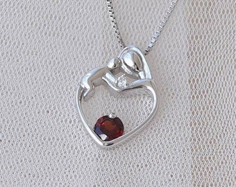Gold Mother and Child Pendant With 