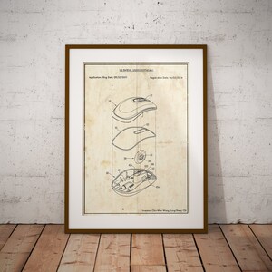 May include: A black and white line drawing of a computer mouse patent. The patent number is US D521293 S1. The application filing date is 09/23/2011 and the registration date is 06/03/2014. The inventor is Chris Wen Wang, Jung Shang Chi.