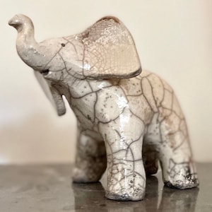 Raku ceramic  baby elephants by Nathalie Hamill