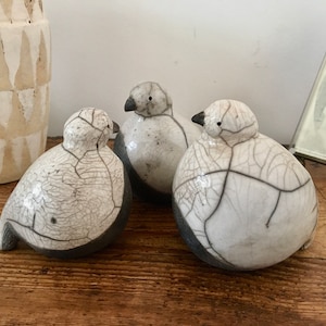 Baby Raku snow partridges by Nathalie Hamill