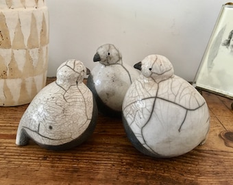 Baby Raku snow partridges by Nathalie Hamill