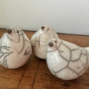 White Raku love bird by Nathalie Hamill
