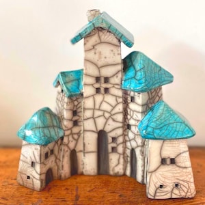 Raku little village with 5 houses, turquoise roofs by Nathalie Hamill