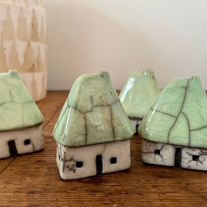 Raku mini house with lime-green roof by Nathalie Hamill thatched roof