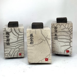 Raku box with Chinese scripts, 13.5cm high, by Nathalie Hamill