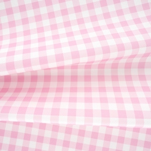 May include: A fabric featuring a classic pink and white gingham check pattern. The material is folded, creating soft, flowing drapes that highlight the repeating square grid design across the surface of the textile in a light, pastel color.