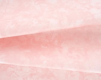 May include: A sheet of translucent, light pink tissue paper featuring a subtle, mottled, cloud-like pattern throughout. The paper is folded into layers, creating soft, overlapping shadows that highlight the delicate, fibrous texture of the material.