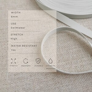 May include: A spool of white elastic ribbon with a width of 6mm. The text on the image specifies high stretch, water resistance, and chlorine resistance. Icons indicate features including stretch, recovery, durability, and chlorine resistance.