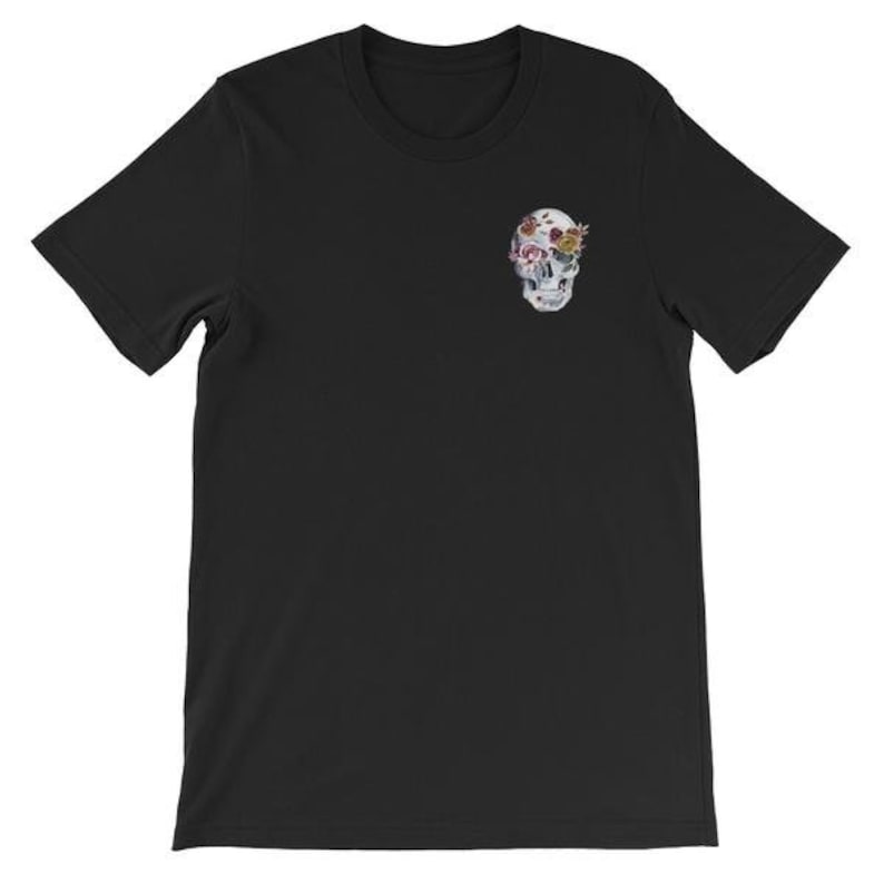 May include: Black t-shirt with a white skull graphic. The skull's eye sockets are filled with colorful flowers.