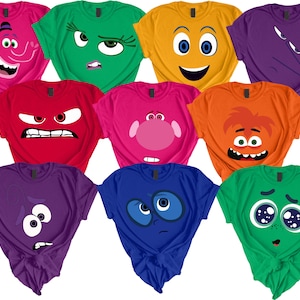 May include: Ten t-shirts with different colored backgrounds and cartoon faces on them. The faces are inspired by the movie Inside Out. The faces are yellow, orange, red, purple, blue, green, and pink.