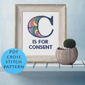 May include: A framed cross stitch pattern with a colorful letter C and the text "C is for Consent".