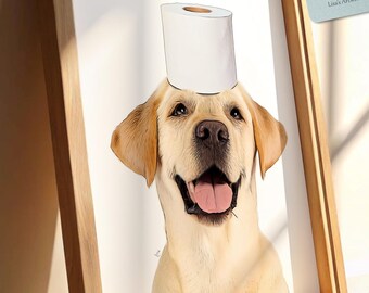 May include: A framed print of a smiling yellow Labrador Retriever wearing a toilet roll on its head. The artwork is in a light wooden frame and includes a tag that reads "Lisa's Artwork". The dog's tongue is visible.