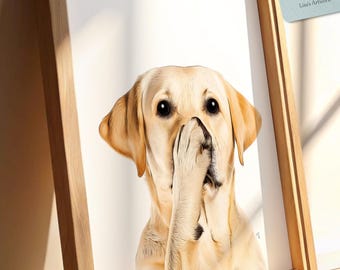 May include: A framed print featuring a Labrador Retriever with its paw covering its nose. The dog has a light yellow coat and dark eyes. The wooden frame is light brown. The tag attached to the frame reads "Lisa's Artwork".