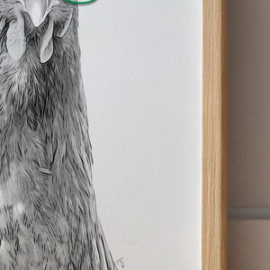 May include: A black and white drawing of a bird's head and neck, with detailed feather textures. The artwork is framed in a light-colored wooden frame, creating a minimalist aesthetic. The artist's signature is visible in the lower right corner.
