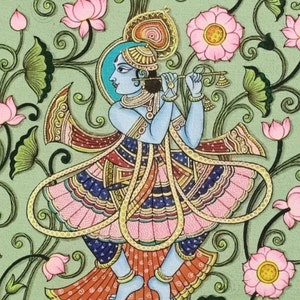 May include: A detailed illustration of a blue-skinned figure playing a flute, wearing elaborate garments with pink and gold details. The figure is set against a backdrop of pink lotus flowers and green foliage on a light green background. The artwork is in a traditional style.