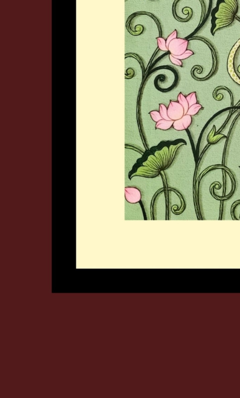 May include: An artistic illustration featuring pink lotus flowers and green leaves against a light green background. The design includes swirling vines and is framed by a black and cream border, set against a maroon backdrop.