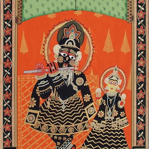 May include: A vibrant Indian painting featuring two figures in ornate black and gold attire against an orange backdrop. The figures are adorned with jewelry and surrounded by decorative elements, including floral borders and geometric patterns. The artwork has a traditional style.