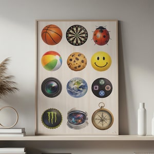 May include: A framed print featuring a collection of circular images. These include a basketball, dartboard, ladybug, beach ball, cookie, smiley face, camera lens, Earth, game controller, Monster energy drink cap, astronaut helmet, and compass.