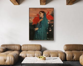 Pode incluir: Uma impressão de arte de parede retangular emoldurada apresentando a pintura de uma pessoa envolta em um xale azul-petróleo com dois pássaros vermelhos brilhantes empoleirados nos ombros, contra um fundo laranja quente e marrom.
