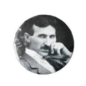 May include: Black and white photo of Nikola Tesla, a famous inventor and engineer, looking thoughtfully into the distance.