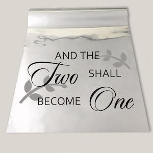Puede incluir: Un fondo metálico plateado con el texto "And the two shall become one" en fuente cursiva negra con un diseño de rama de hojas grises.