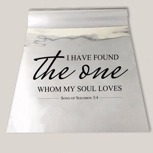 May include: A silver metallic background with black text that reads "I HAVE FOUND the one WHOM MY SOUL LOVES - SONG OF SOLOMON 3:4"