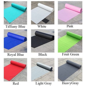 May include: Nine rolls of carpet in various colors, including Tiffany Blue, White, Pink, Royal Blue, Black, Fruit Green, Red, Light Gray, and Heavy Gray. The carpet is rolled up and lying on a gray concrete surface.
