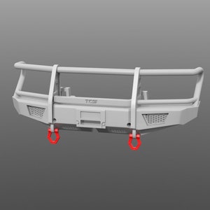 May include: A white metal front bumper with a black mesh grille and two red tow hooks. The bumper has a black metal bar across the top and the word "TGS" printed on the front.