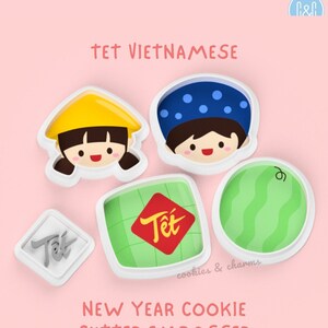 May include: Set of five cookie cutters for Vietnamese New Year, featuring a girl in a conical hat, a boy in a blue hat, a green and white banh chung, a watermelon, and a red and gold "Tet" sign.