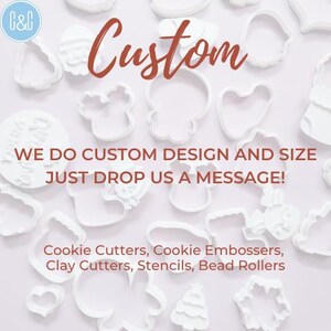 May include: White plastic cookie cutters of various shapes and sizes, including a Christmas tree, a snowman, a reindeer, and a star. The text "Custom" is written in red letters above the cutters. The text "WE DO CUSTOM DESIGN AND SIZE JUST DROP US A MESSAGE!" is written in black letters below the cutters. The text "Cookie Cutters, Cookie Embossers, Clay Cutters, Stencils, Bead Rollers" is written in black letters below the message.