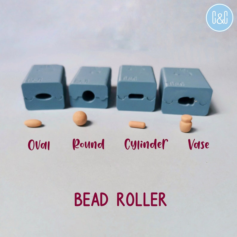 May include: Four blue silicone bead roller molds with different shapes: oval, round, cylinder, and vase. Each mold is labeled with its corresponding shape.  The molds are on a light blue surface.  The text "BEAD ROLLER" is printed in maroon below the molds.