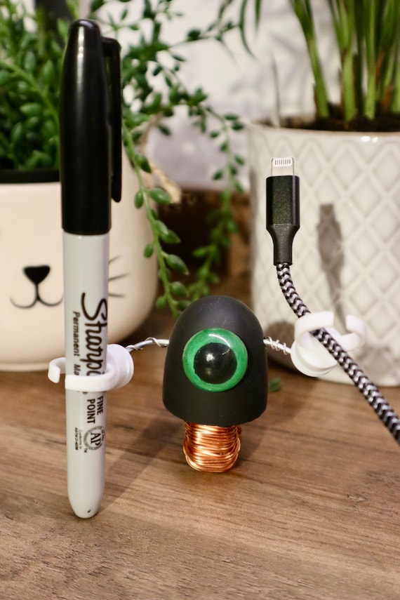 A tiny monowheel robot sculpted entirely from salvaged circuit boards, chips, and electronic scraps — the kind of desk companion that sparks a conversation every single time.