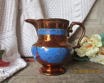 Antique PITCHER in JERSEY earthenware with blue and bronze glaze.