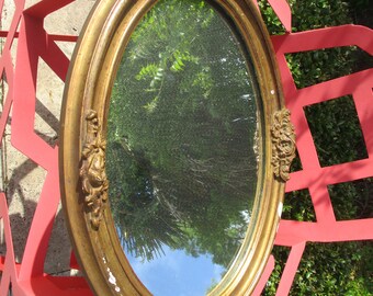 Antique French Oval MIRROR in Wood and Plaster with Golden Bronze Patina. Decor of ROSES 19th century