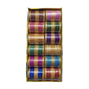 May include: A rectangular box containing twelve sets of bangles arranged in two columns. Each set features a central coloured band in shades of brown, purple, green, gold, blue, and magenta, flanked by thin, textured gold-toned metallic rings.